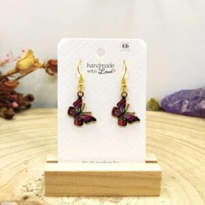 Oorhangers vlinder in roze en oranje